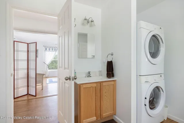 a view of a bedroom with a bed and a window