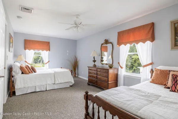 an aerial view of a house with a yard swimming pool and outdoor seating