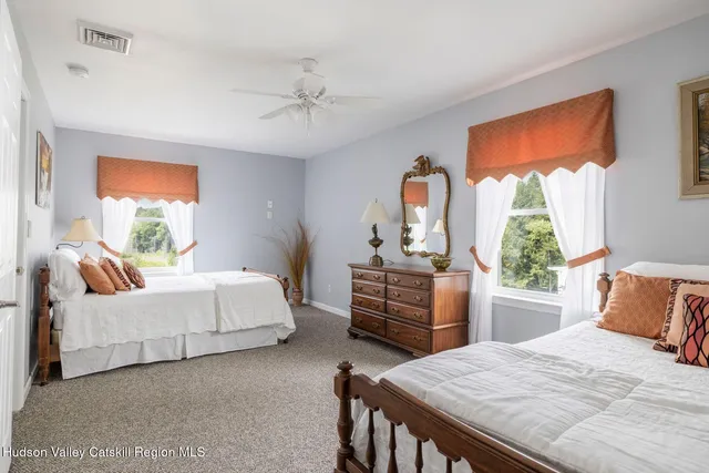 an aerial view of a house with a yard swimming pool and outdoor seating