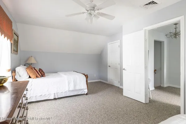 a view of a garden with a building in the background