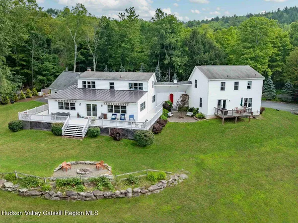 a house view with a seating space and garden view