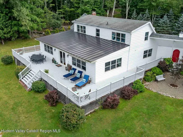 a view of a two chairs on the roof deck