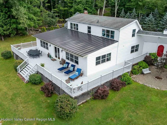 a view of a two chairs on the roof deck