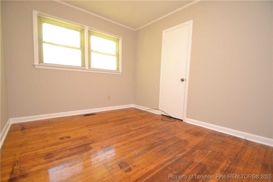 717 Friar Tuck Road Raleigh, NC 27610 - Photo 11 of 31 an empty room with a window
