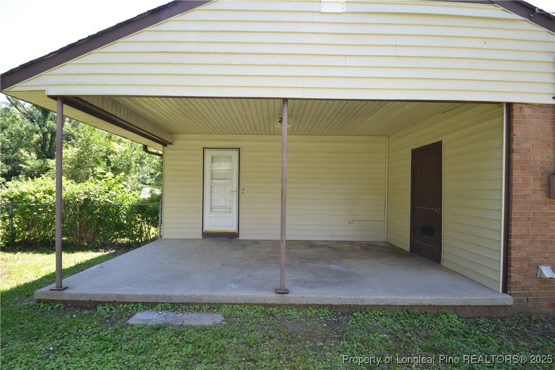 717 Friar Tuck Road Raleigh, NC 27610 - Photo 26 of 31 a backyard of a house with lots of green space