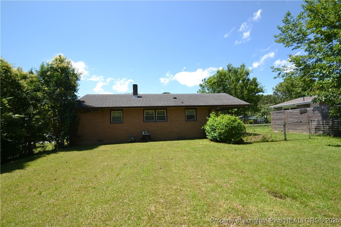 717 Friar Tuck Road Raleigh, NC 27610 - Photo 31 of 31 a front view of a house with a yard and garage