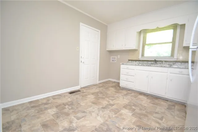 a view of a kitchen with a sink