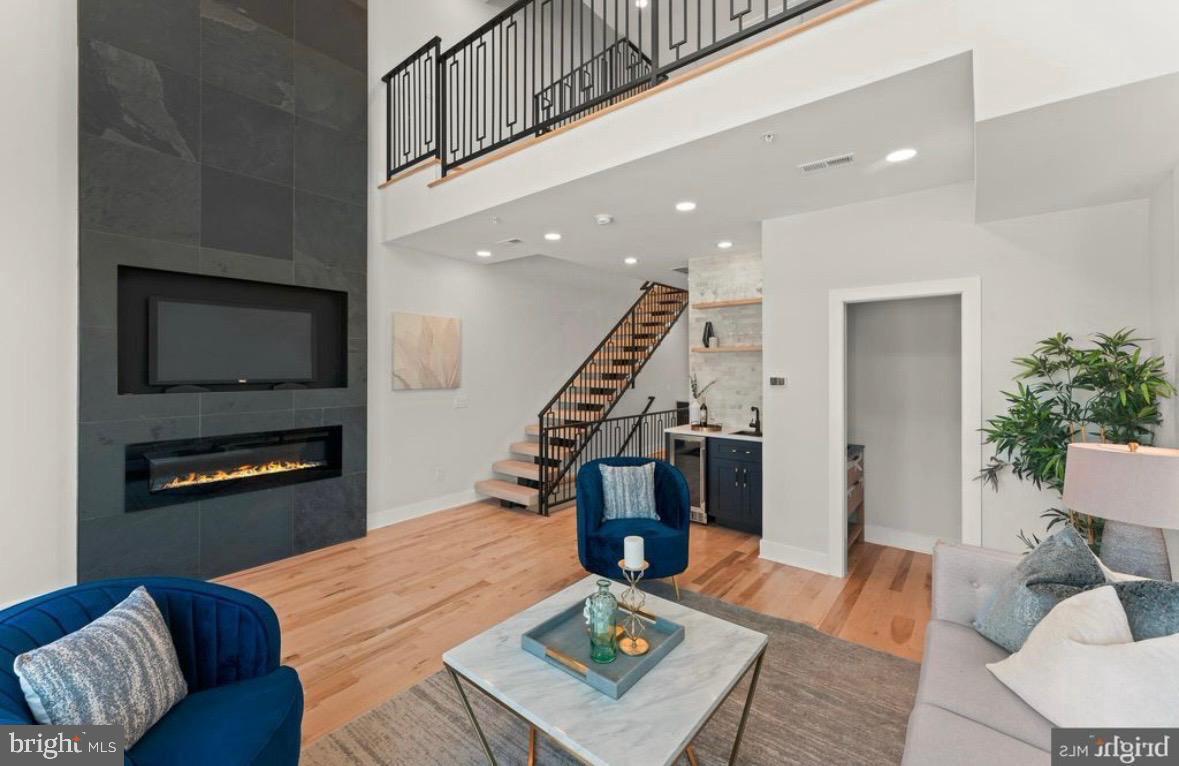 6983 Silverwood Street Philadelphia, PA 19128 - Photo 15 of 18 a living room with furniture and a flat screen tv