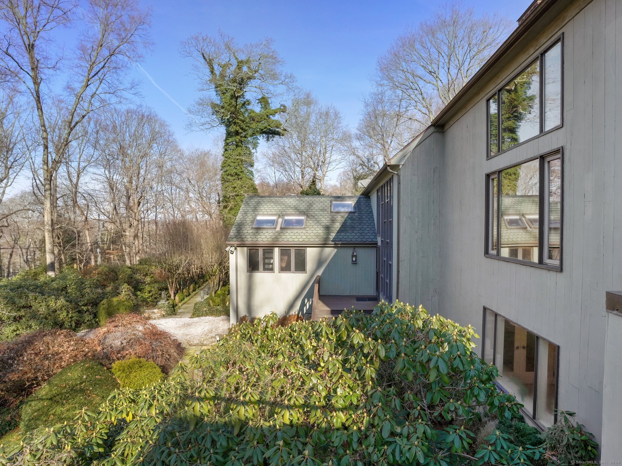 8 Bayberry Ridge Road Westport, CT 06880 - Photo 13 of 39 a front view of a house with a yard