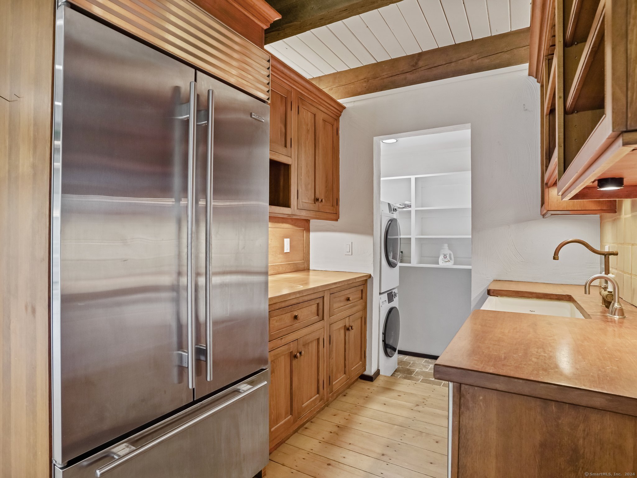8 Bayberry Ridge Road Westport, CT 06880 - Photo 3 of 39 a kitchen with a refrigerator sink and cabinets