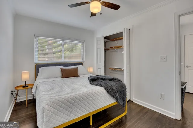 a bedroom with a bed and window