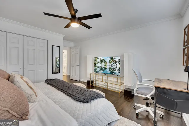 a bedroom with a bed a desk and chair