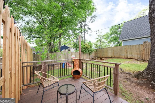 a view of a chair and table on the wooden floor