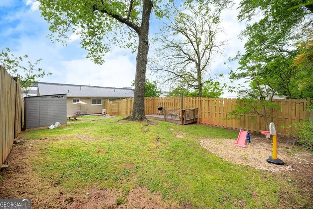 a backyard of a house with entertaining space and outdoor seating