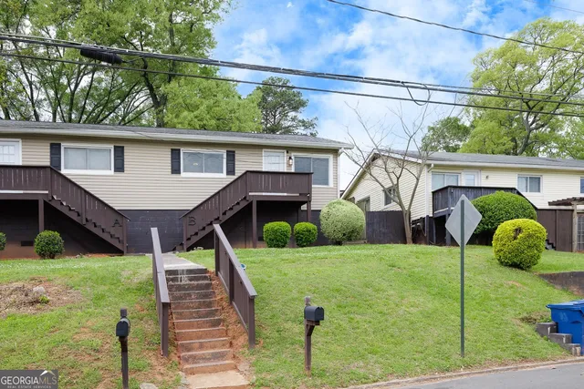 a view of front of house with a yard