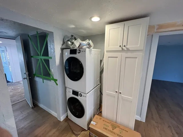 a view of a hallway with washer and dryer