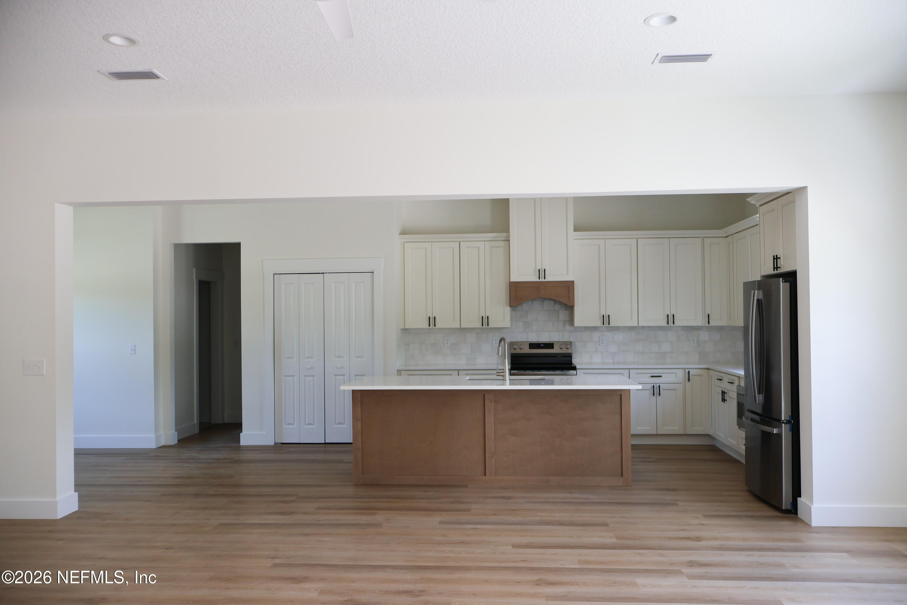 261121 Rowe Road Hilliard, FL 32046 - Photo 5 of 33 a view of kitchen with wooden floor