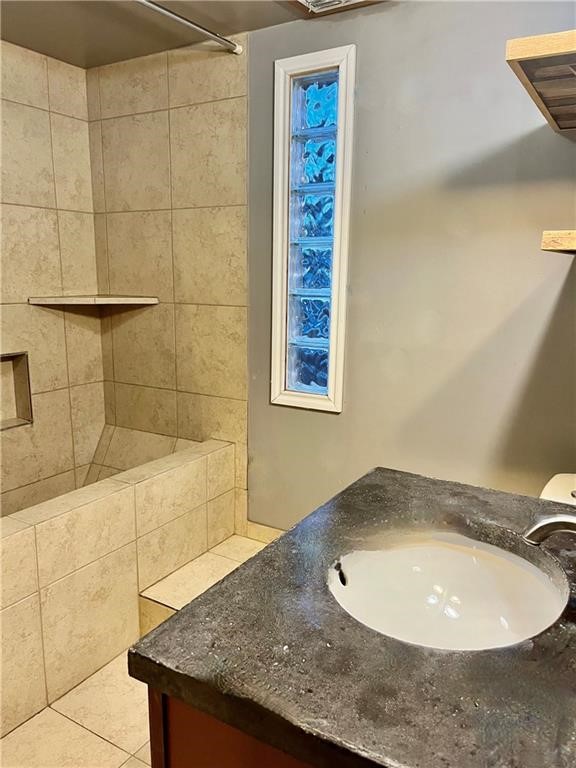 2525 Ave B Ingleside, TX 78362 - Photo 5 of 9 a bathroom with a granite countertop sink and mirror