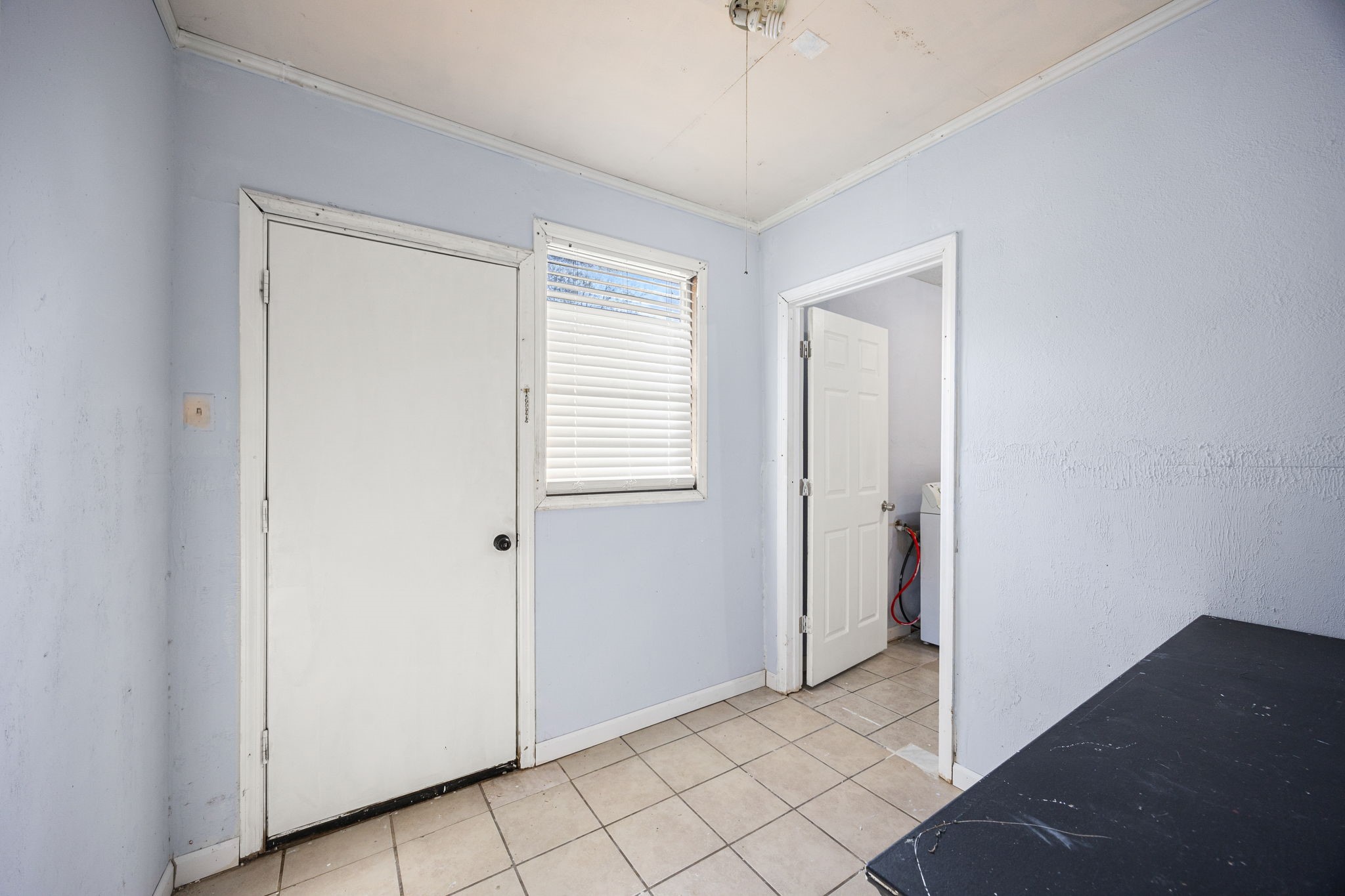 340 Magnolia Drive Houston, TX 77336 - Photo 24 of 48 a view of an empty room with window and chandelier fan