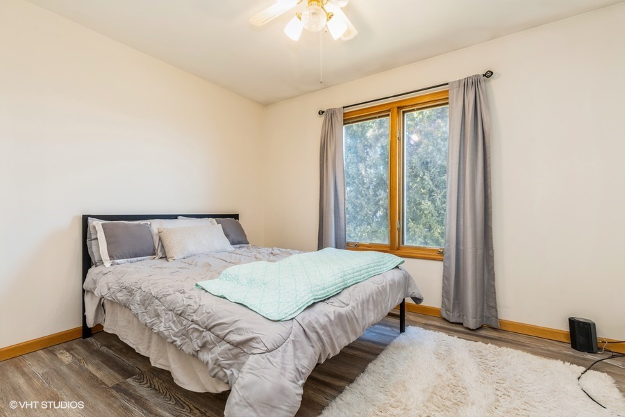 2808 Tahoe Lane Spring Grove, IL 60081 - Photo 11 of 21 a bedroom with a large bed and a large window