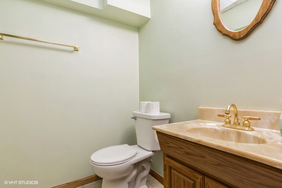 2808 Tahoe Lane Spring Grove, IL 60081 - Photo 21 of 21 a bathroom with a sink a toilet and a mirror