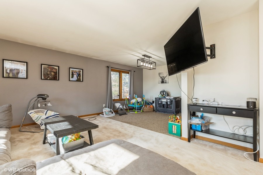 2808 Tahoe Lane Spring Grove, IL 60081 - Photo 3 of 21 a living room with furniture and a flat screen tv