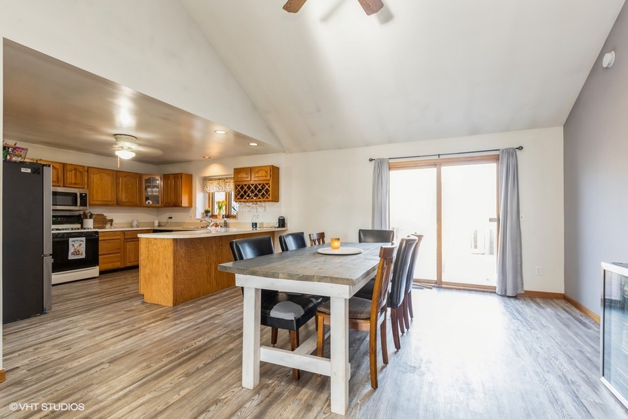 2808 Tahoe Lane Spring Grove, IL 60081 - Photo 5 of 21 a view of a dining room with furniture window and wooden floor