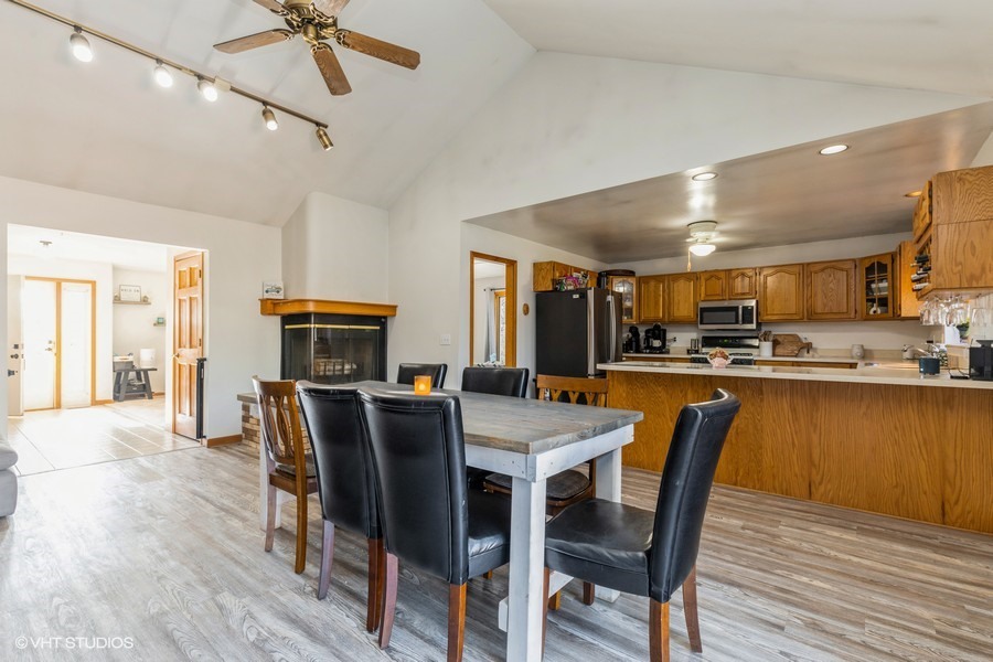 2808 Tahoe Lane Spring Grove, IL 60081 - Photo 6 of 21 a view of a dining room with furniture and wooden floor