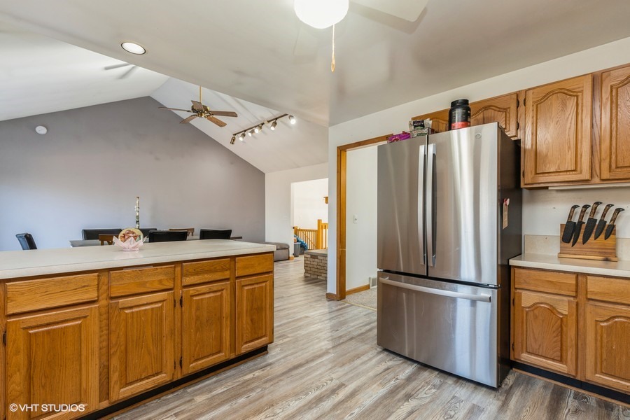 2808 Tahoe Lane Spring Grove, IL 60081 - Photo 8 of 21 a kitchen with wooden cabinets and stainless steel appliances