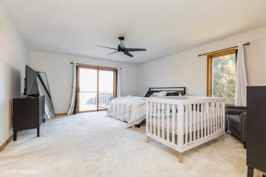 2808 Tahoe Lane Spring Grove, IL 60081 - Photo 9 of 21 a bedroom with a bed and a large window
