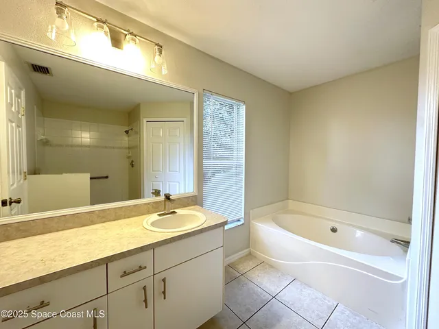 a bathroom with a bathtub and a sink