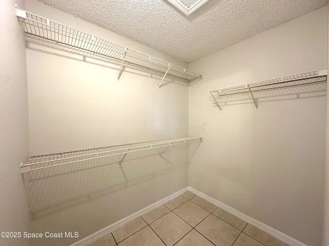 a view of a room with racks on the wall