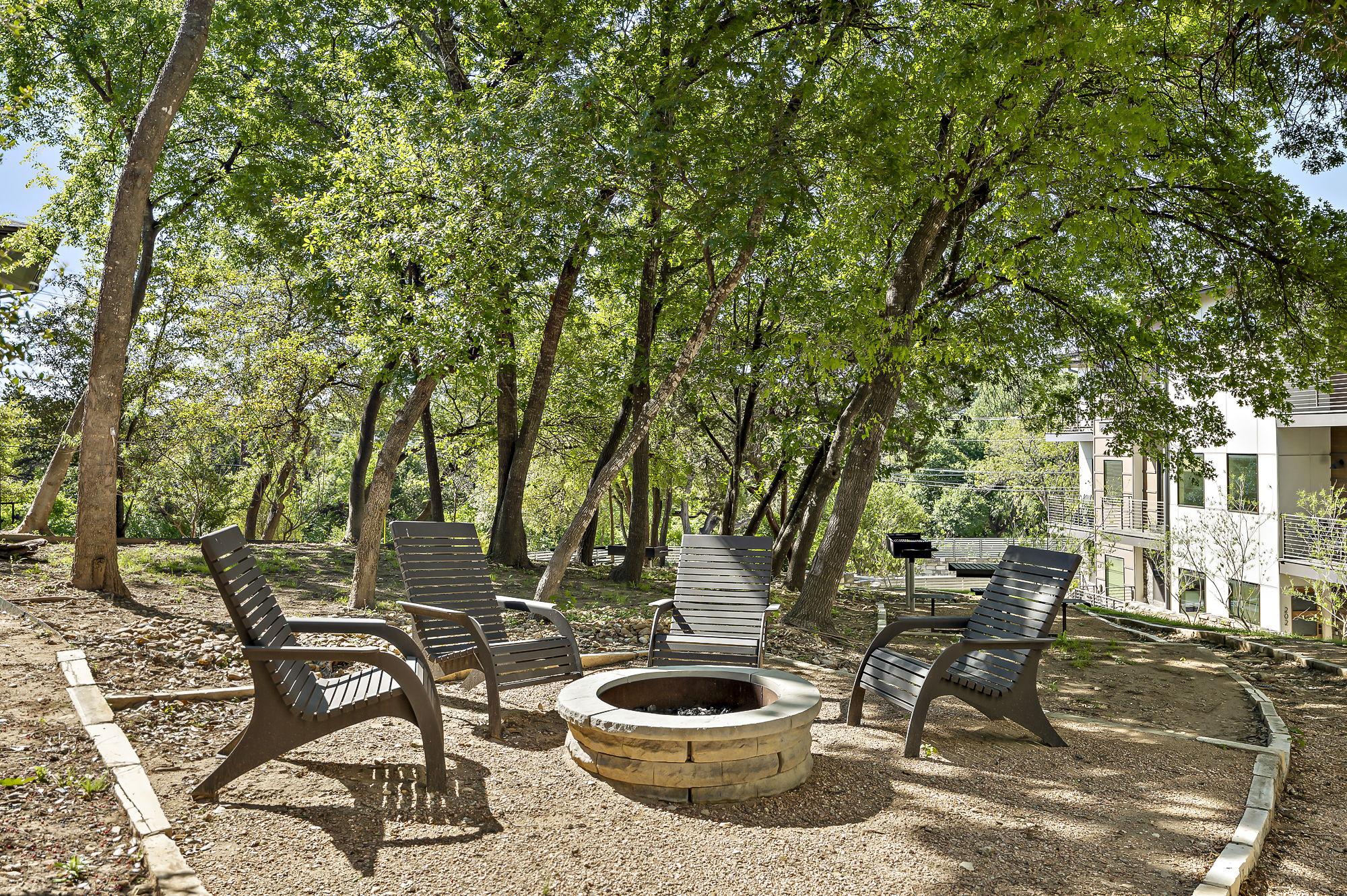 3700 Clawson Road, Unit 501 Austin, TX 78704 - Photo 5 of 40 Right outside your front door: lush green community space with firepit, seating and grill