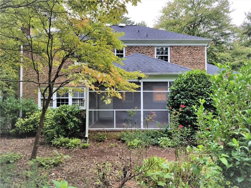 1602 Beechtree Road Greensboro, NC 27408 - Photo 23 of 24 Exterior rear & Screened in Porch