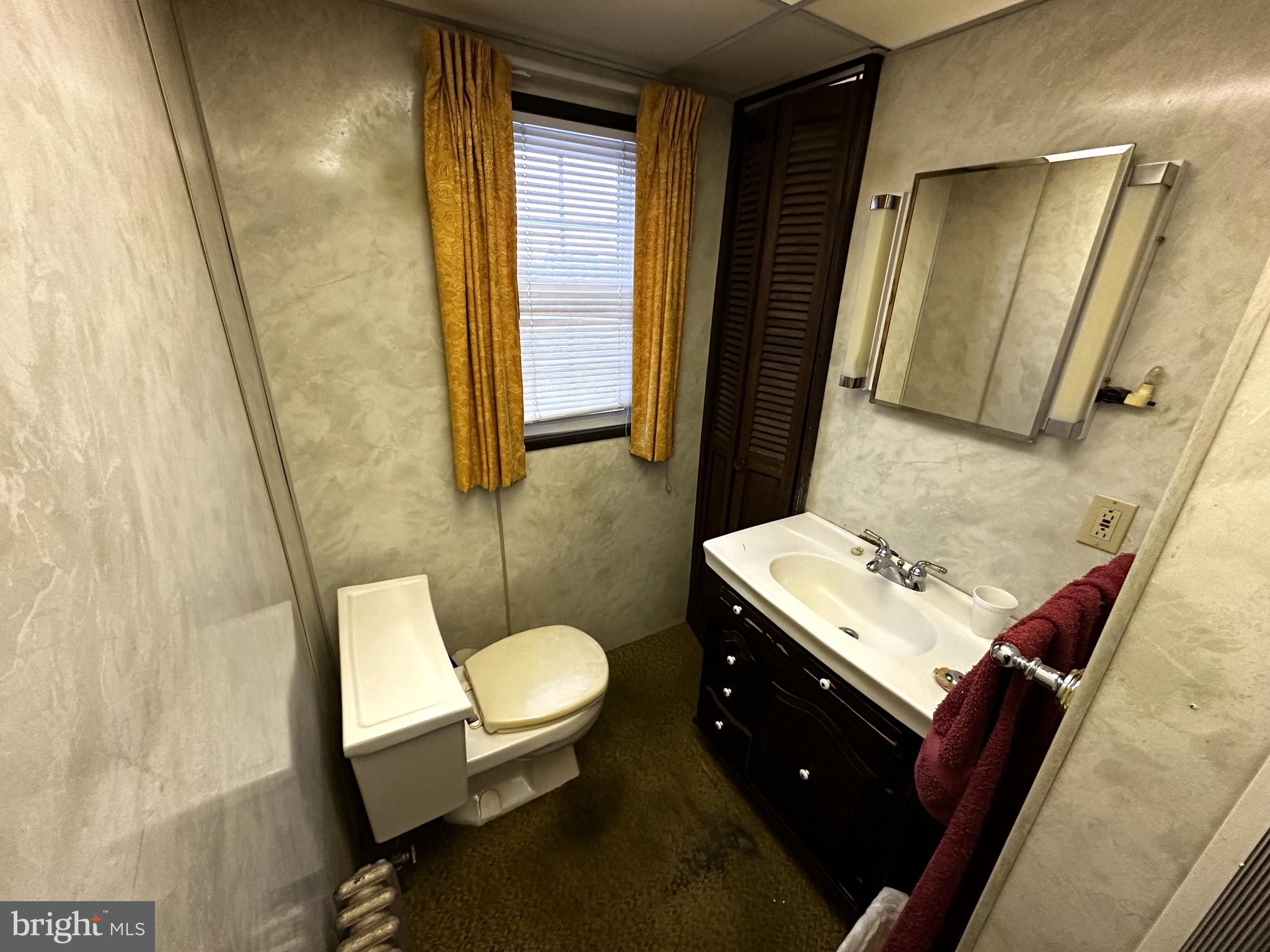 239 East Hazard Street Summit Hill, PA 18250 - Photo 15 of 39 a bathroom with a sink toilet mirror and vanity