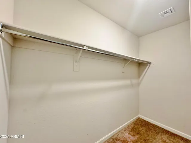 a view of an empty room and a window