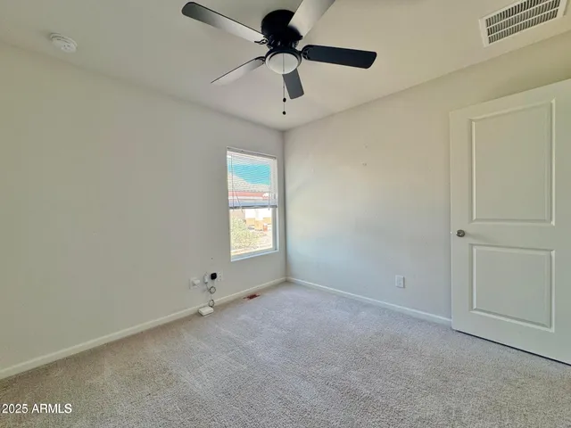 a bathroom with a granite countertop sink toilet a mirror and shower