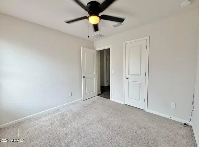 a view of a room with rack and wooden floor