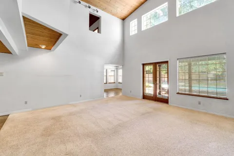 a living room with fireplace furniture and a wooden floor