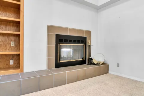 a view of a kitchen with a sink and a window