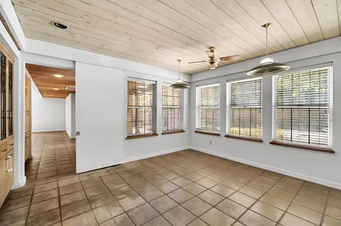 a large kitchen with a large window cabinets and stainless steel appliances