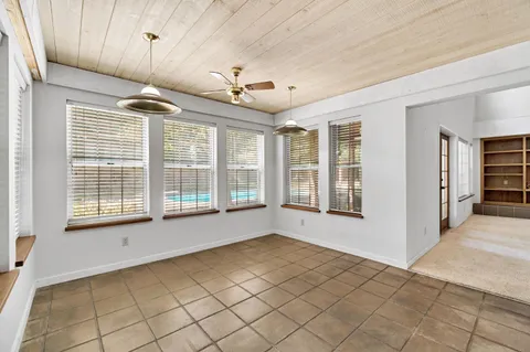 a large kitchen with cabinets and stainless steel appliances