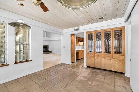 a kitchen with stainless steel appliances granite countertop a refrigerator and a stove