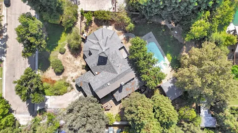 an aerial view of a house with outdoor space
