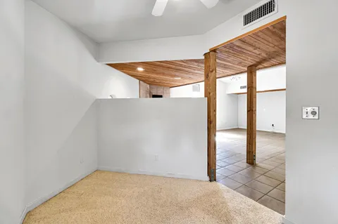 a bathroom with a tub and shower