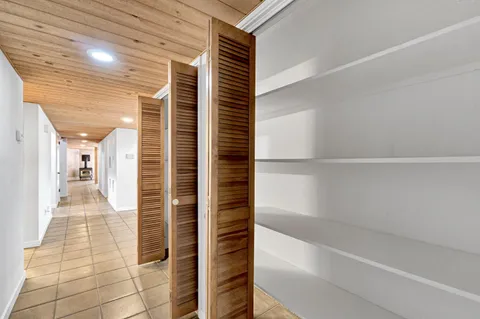 an aerial view of a house with a yard and garden