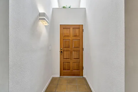 a view of an empty room with windows