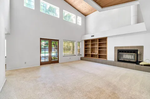 a living room with a fireplace and a couch