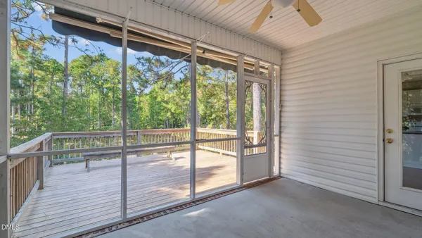 a view of a balcony with wooden floor