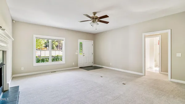 a view of an empty room with a window